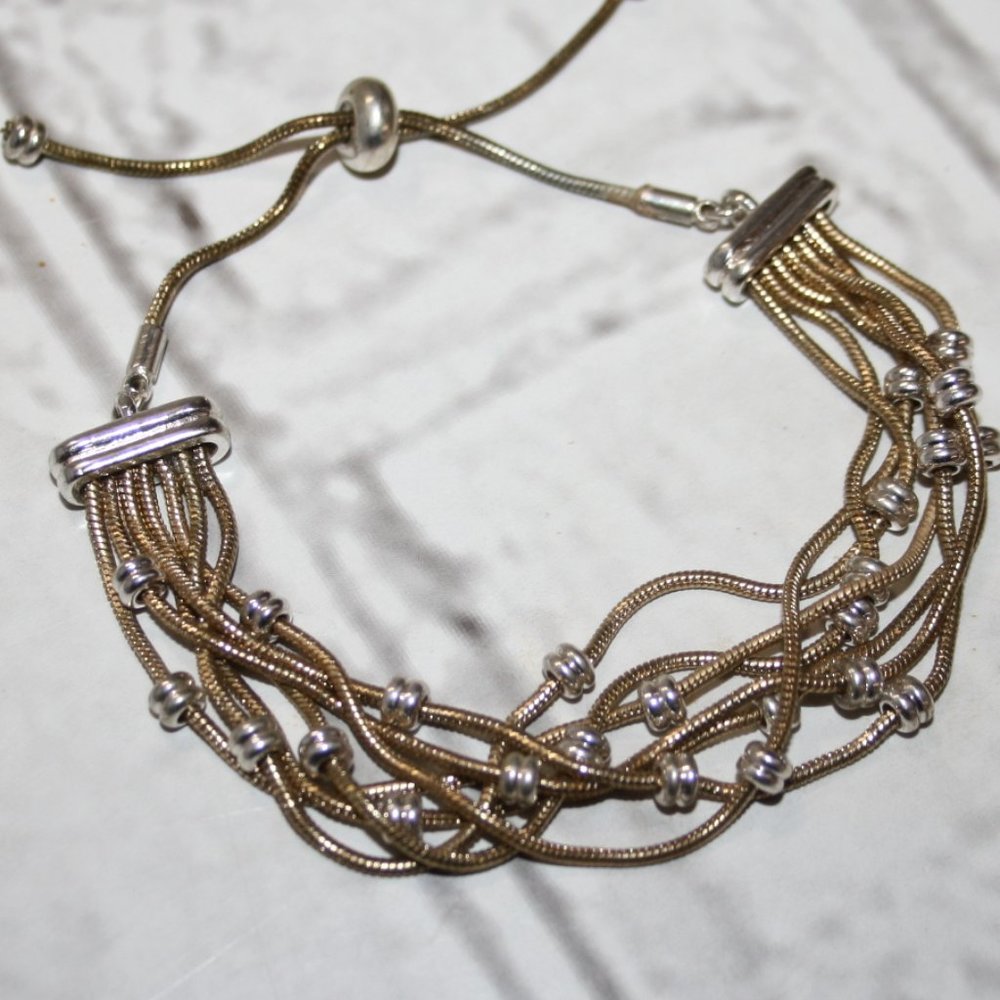 Beautiful multi-chain gold and silver bolo style bracelet adjustable